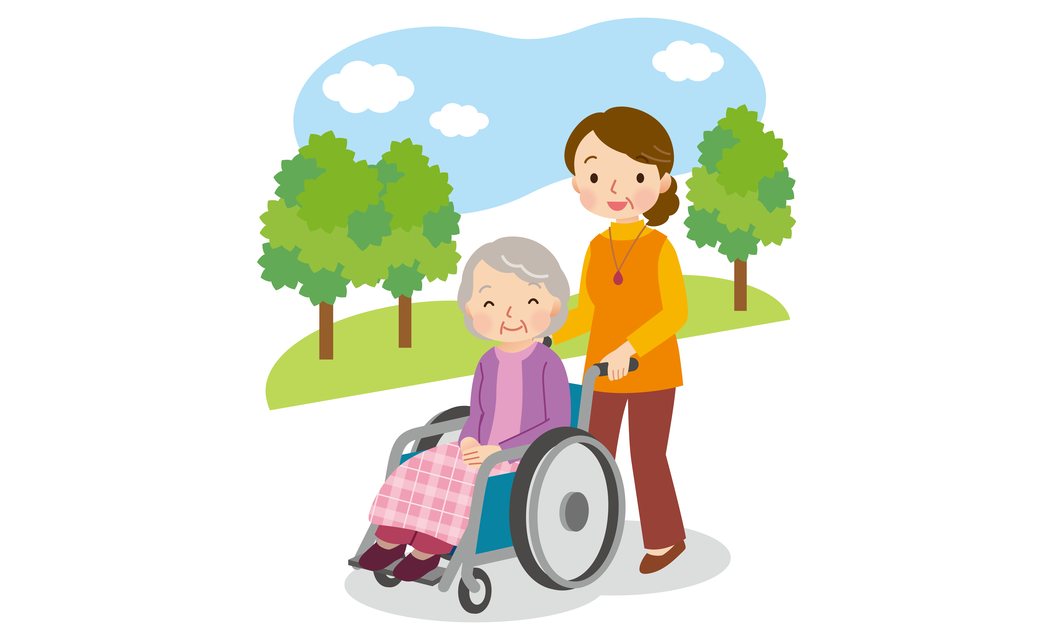 高齢者の女性が乗っている車椅子を押す女性